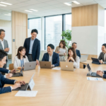 多様な年齢層のビジネスパーソンが会議室で協力的に対話している様子